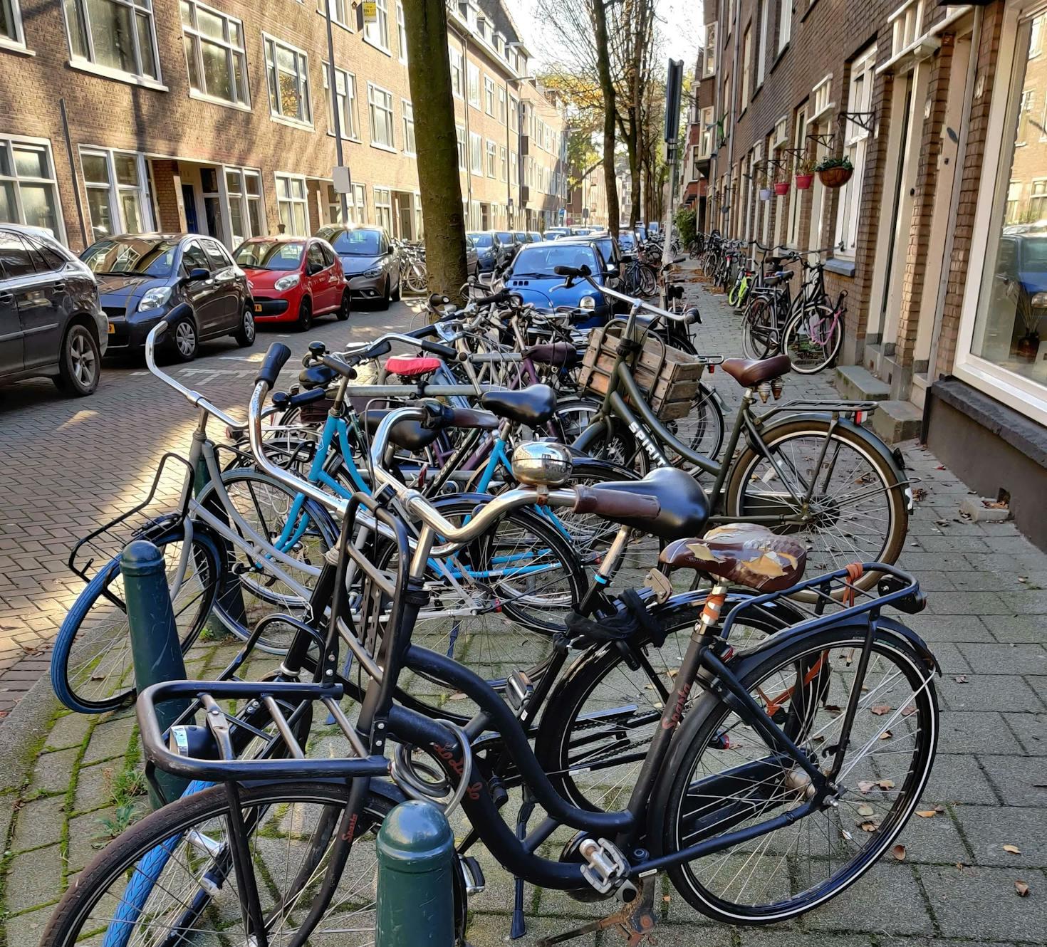Bicycles parked on a corner of the street in  Bergpolder Rotterdam