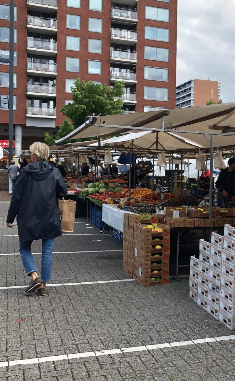 Photo of a market in Rotterdam with fruit and vegetables on sale. Image belongs to the project 'The public markets of Rotterdam' by Business Design Agency